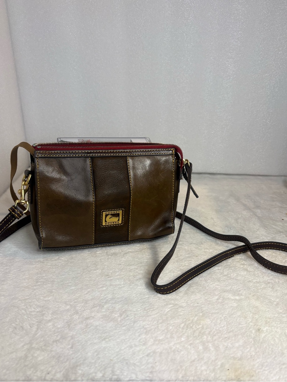 Dooney & Bourke Brown Leather Crossbody purse with Red Zip Accent